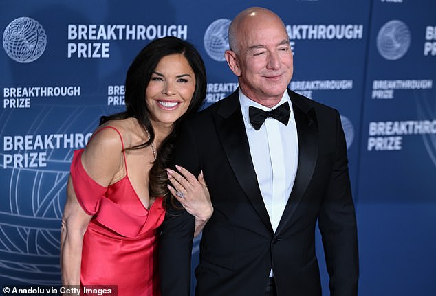 Bezos is now married to  former journalist Lauren Sánchez (pictured together)