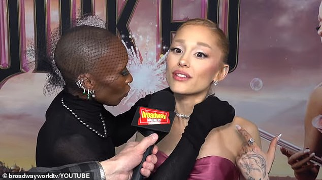 'I'm so sorry,' Erivo says, claiming something is 'not right' as she continues fiddling with the necklace