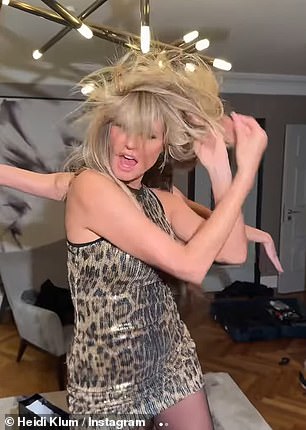 Heidi showed off her amazing figure in a stunning sequin leopard print minidress