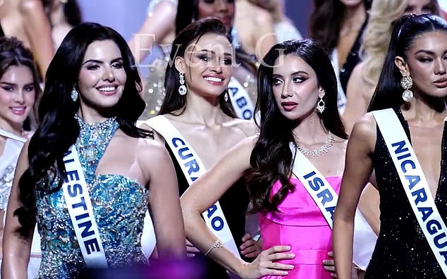 The Israeli beauty queen, right, has claimed the video where she appeared to give Miss Palestine, left, the side-eye was from a 'third-party',  designed to intentionally mislead audiences