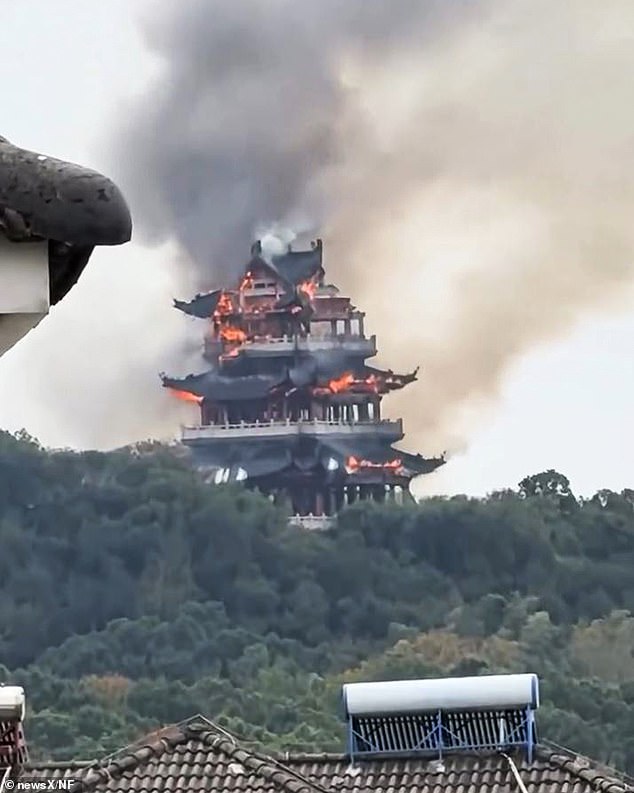 Dramatic footage captured the three-storey building engulfed in orange flames as thick clouds of black smoke drifted into the sky