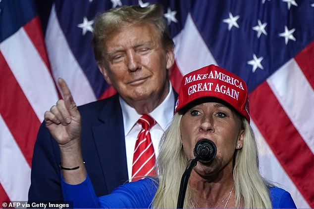One of Donald Trump 's most fervent supporters says her life is now in danger after the U.S. President dramatically turned on her in a row over the Epstein files. Pictured: Marjorie Taylor Greene (R) speaks alongside Donald Trump in 2024