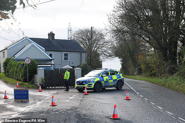 Irish police at the scene on the L3168 just outside Dundalk, Co Louth, where three men and two women aged in their 20s died following a road traffic collision