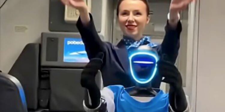 Watch humanoid robot AIR STEWARD greets passengers and gives safety demo on packed flight in eerie vision of the future