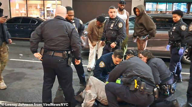 Cops are seen giving immediate medical attention to Boyd outside Sei Less restaurant in NYC