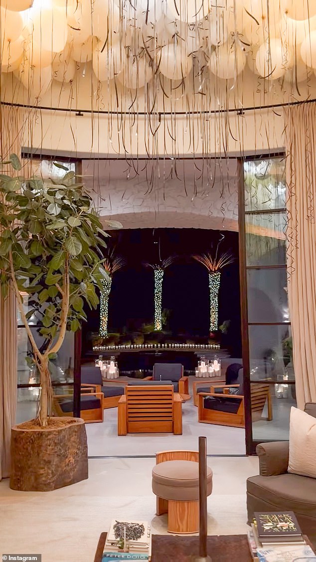 There was a large cake and balloons as both Barker and Kardashian wore black