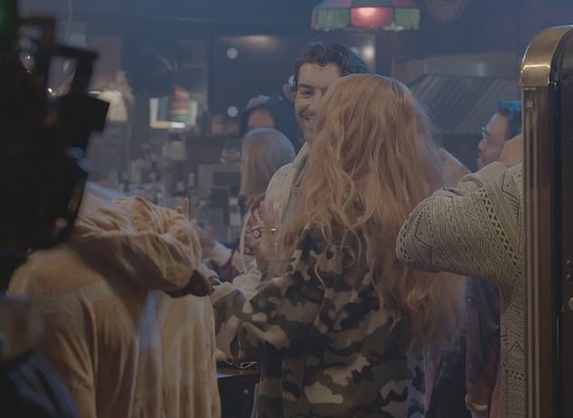 In the recording, Baldoni stands with Lively and co-star Jenny Slate at a table, casually chatting