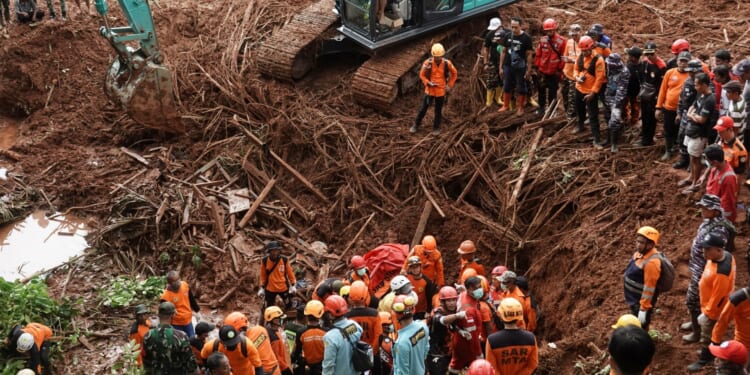 Landslide kills 18 as hundreds of rescuers desperately search through dense jungle for dozens more missing