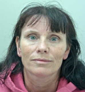 Mugshot of Pamela Urvoy, a woman with dark hair and light eyes.