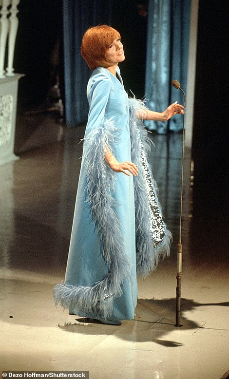 Cilla Black (pictured) performs at the Royal Variety show in 1969, wearing a Jean Varon/ John Bates design
