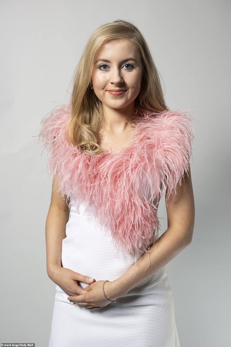 A Cilla 1960s/70s white ribbed dress trimmed with dramatic pink ostrich feathers on the collar