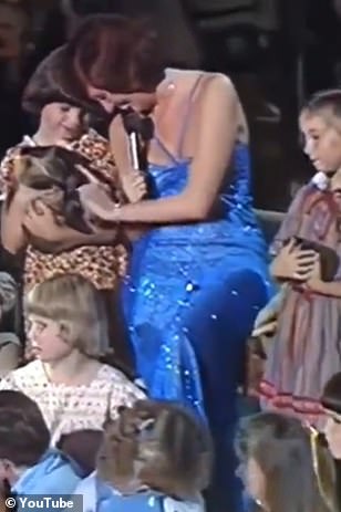 Cilla strokes a rabbit during her moving rendition of 'Bright Eyes'