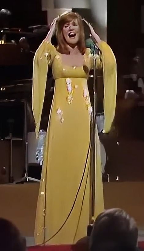 Cilla performs on the 'Cilla show' in the yellow gown, which is going under the hammer from just £70