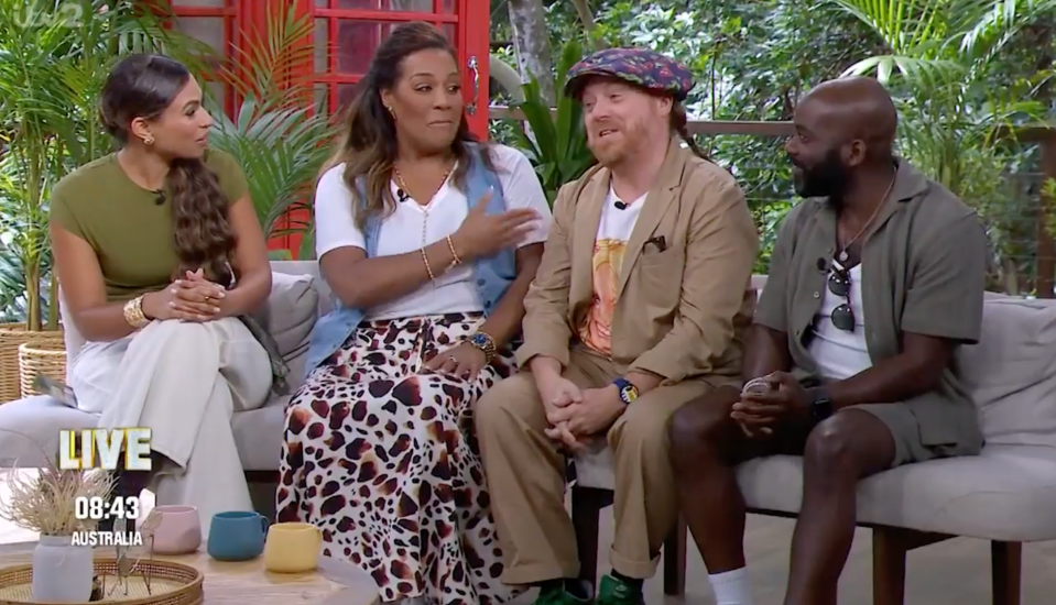 Four panelists on a talk show.