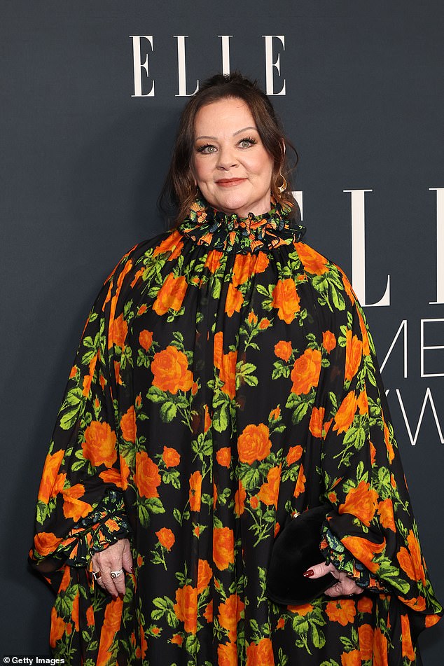 She accessorized with a clutch