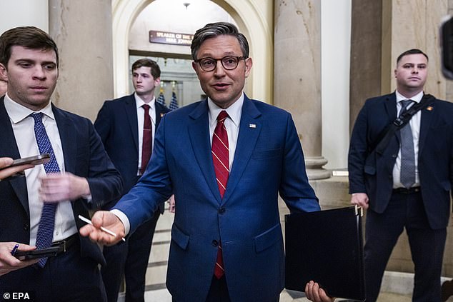 Republican Speaker of the House Mike Johnson (C) speaks on the Epstein files to reporters