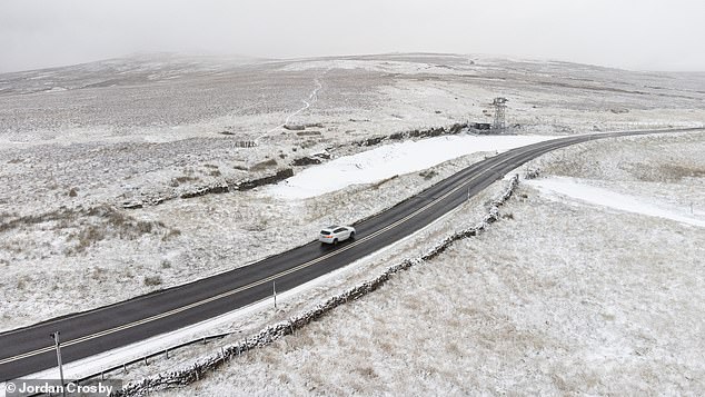 Snow falls in Hartside, Cumbria, this morning as the UK is gripped by a cold snap this week