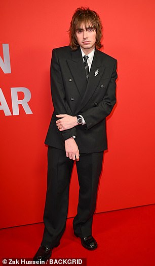 Liam Gallagher's son Gene made an appearance and dressed up in a black suit and striped tie
