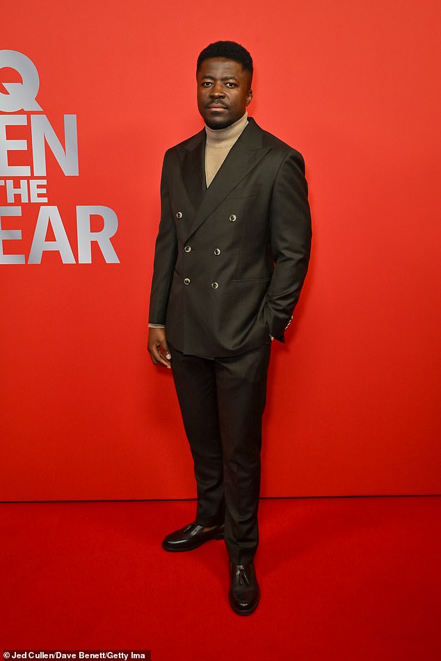 Merveille Lukeba looked smart in a green double breasted suit