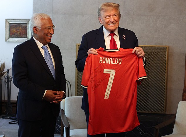 Trump pictured holding a signed Ronaldo jersey