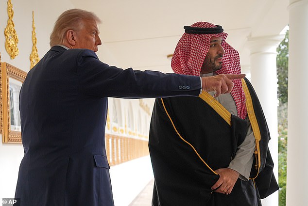 Trump and Bin Salman pictured together as they walk towards the Oval Office on Tuesday