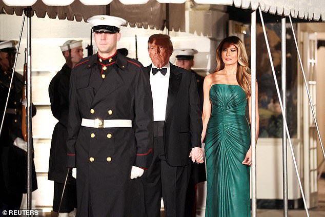 The Trumps held hands while they waited for MBS to arrive back to the White House after several hours of meetings Tuesday afternoon, with the weather turning cold and rainy