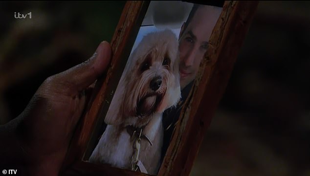 Kelly was overcome with emotion when she was handed a photo of her husband Jeremy Parisi and dog Teddy