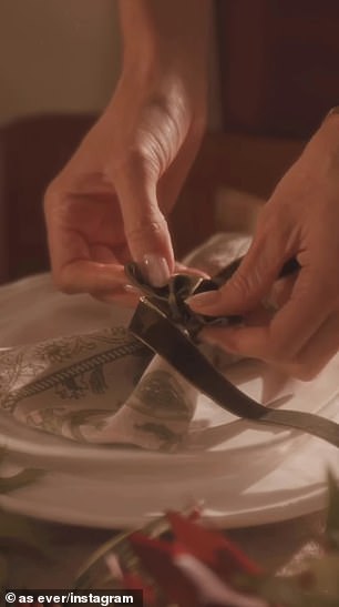 She had cloth napkins tied with green velvet ribbons placed atop porcelain dishes