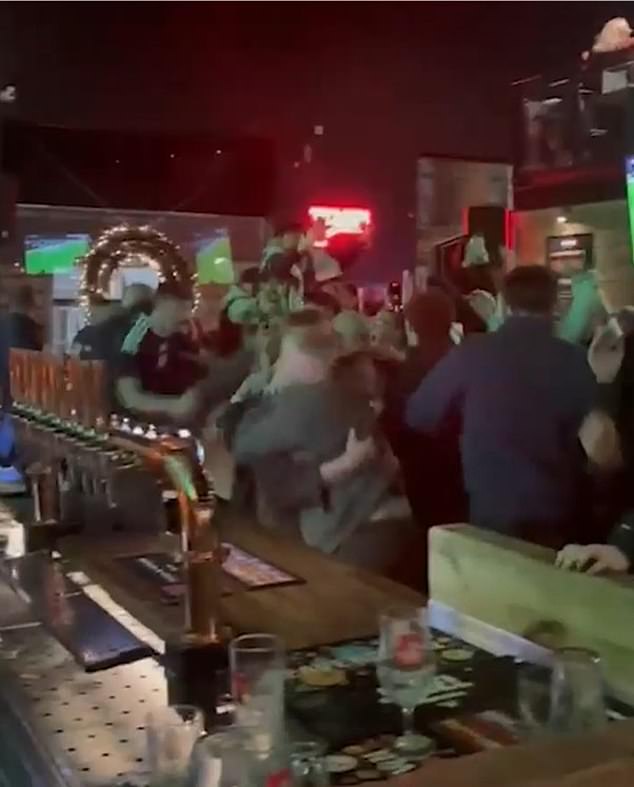 Fans burst into celebrations in pubs across the land as they witnessed a historic qualification