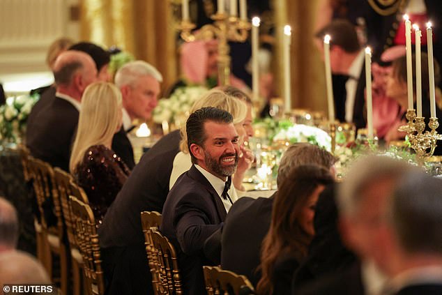 Donald Trump Jr. chats to other guests at the dinner at the White House