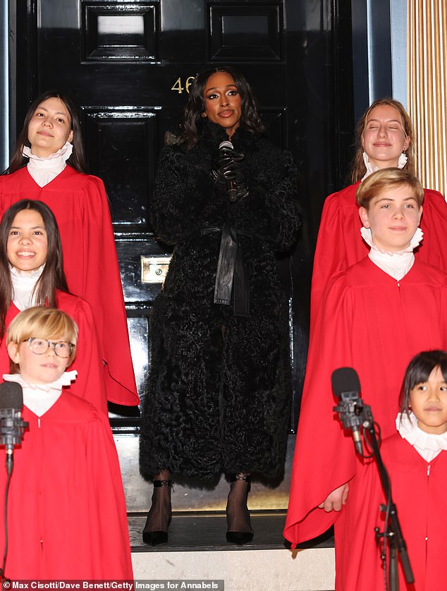 The singer, 37, who performed at the event with the Capital Children's Choir, sang as thousands of lights were switched on, illuminating the incredible display