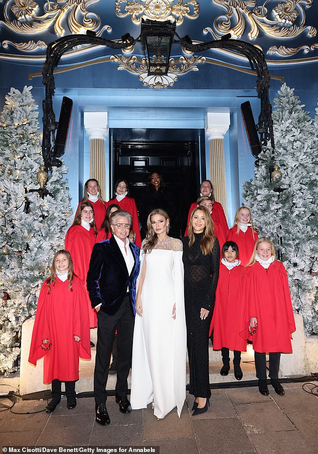 This year's installation transforms the iconic entrance on Berkeley Square into an ornate wardrobe, with doors opening to reveal a winter realm of snow-dusted trees and shimmering icicles (pictured left Richard Caring, centre Tatiana Kharchylave and right Patrica Caring)