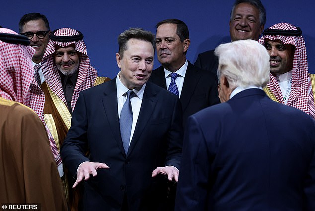 U.S. President Donald Trump and Elon Musk interact during the U.S.-Saudi Investment Forum in Washington, D.C., U.S., November 19, 2025