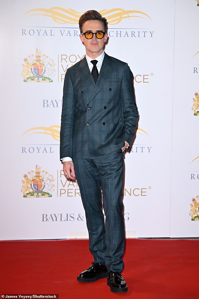 Tom Fletcher kept it dapper in a checked navy suit, navy tie and white shirt