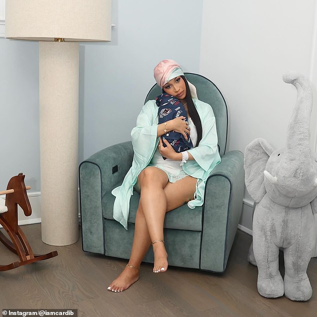 The I Like It rapper snuggled her newborn child