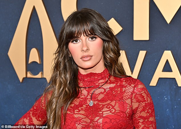 Langley said in her acceptance speech: 'I feel like this is a song that just keeps on giving because the fans keep on listening to it.' The singer pictured backstage