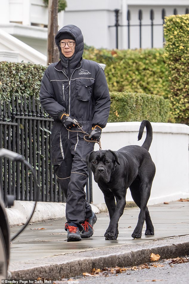 A man is pictured walking the brute who attacked Parker Bowles's pet dog Maud