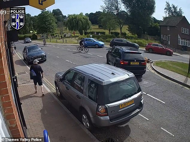 CCTV footage of the collision in June, shared by Thames Valley Police, shows the black BMW turn right, cutting in front of a cyclist, believed to be in her 50s