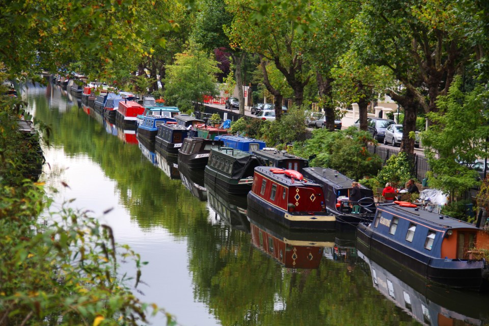 Houseboats moored along the Regent's Canal in Little Venice, London.