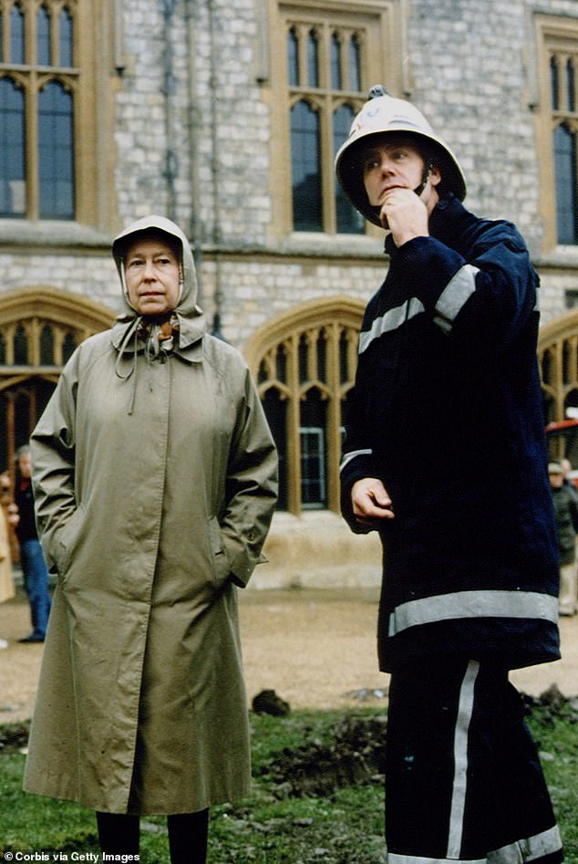 Poignant images showcased the late Monarch looking incredi bly forlorn an dressed in a headscarf, raincoat and wellington boots as she looked on anxiously at the horrific damage to her beloved childhood home