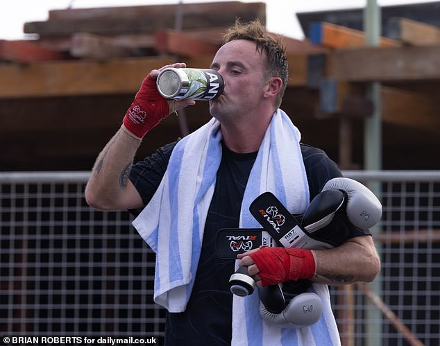 The presenter sported a pair of light grey boxing gloves as he worked up a sweat during the 'Box and Burn' class