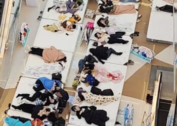 ‘World’s laziest man’ crowned after lying still for 33hours while wearing a NAPPY in bizarre ‘lie flat’ competition