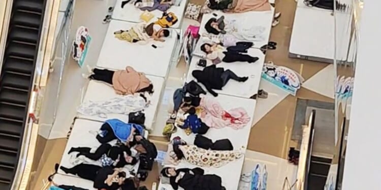 ‘World’s laziest man’ crowned after lying still for 33hours while wearing a NAPPY in bizarre ‘lie flat’ competition