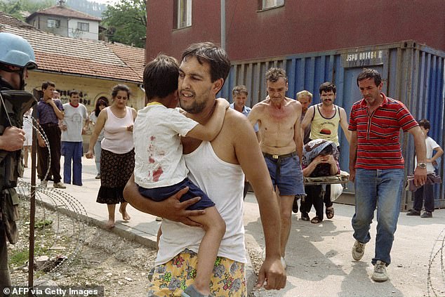 A man carries his son, injured in the back by mortar shrapnel, in front of a woman on a stretcher, 1993, after a shell landed near a water point in the Bosnian capital