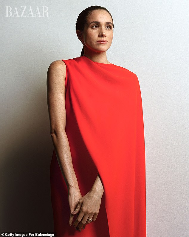 She wore two custom Balenciaga outfits for her catwalk debut, including a black dress with a cape draped over her left shoulder