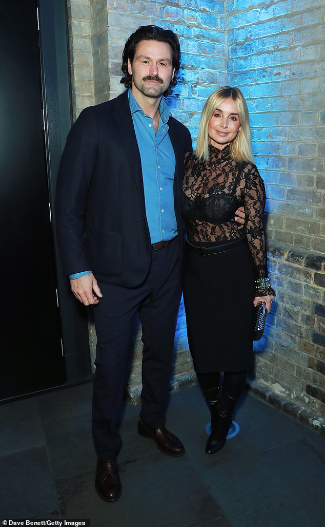 After flying solo on the red carpet, the songstress was joined by her boyfriend Drew Michael, 41, inside the venue with the loved-up couple posing for a photo together