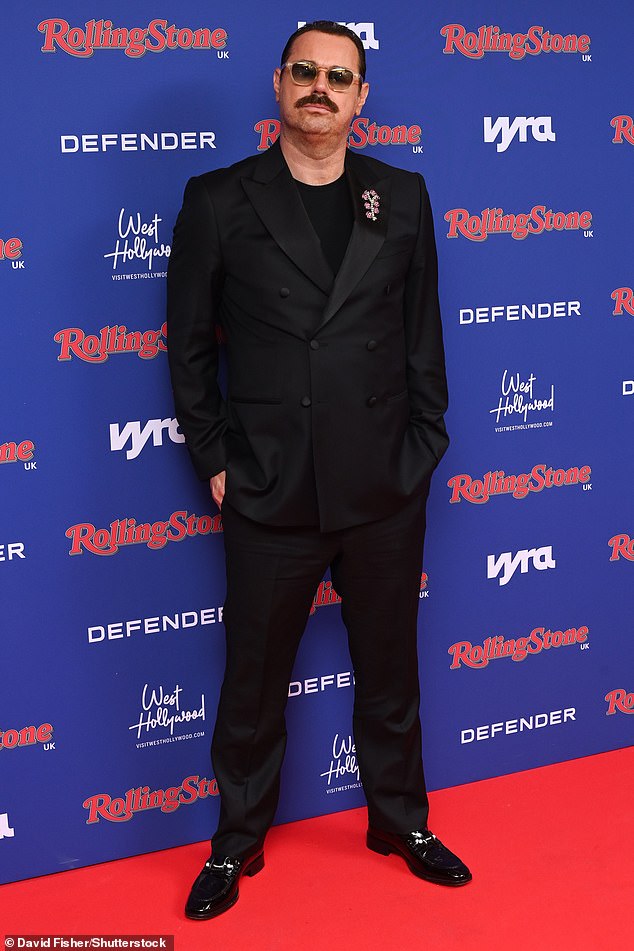 Meanwhile her dad Danny, who is the host of the ceremony, looked dapper in a black satin double-breasted suit with a bejewelled brooch and aviator sunglasses