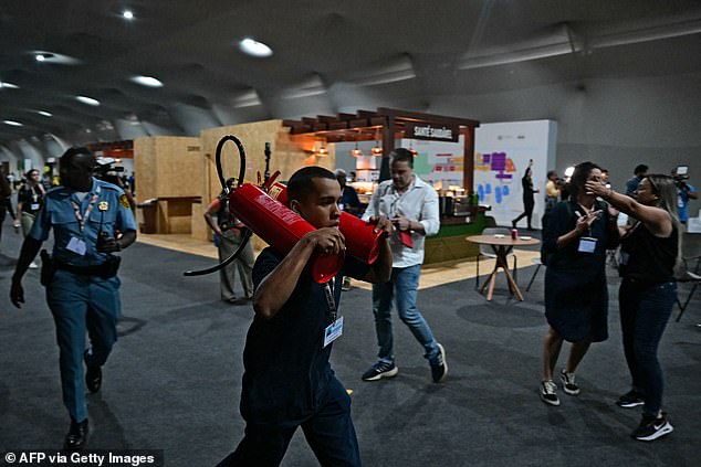 Organisers quickly announced that the fire was under control, but fire officials ordered the entire site evacuated for safety checks