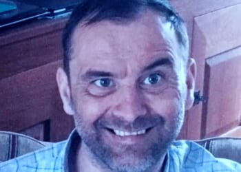 Dad stabbed to death is pictured as family pay tribute to 'much loved father' & cops charge man with murder