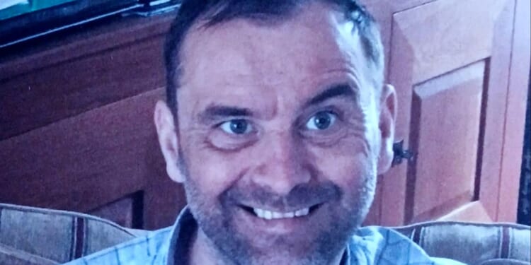 Dad stabbed to death is pictured as family pay tribute to 'much loved father' & cops charge man with murder